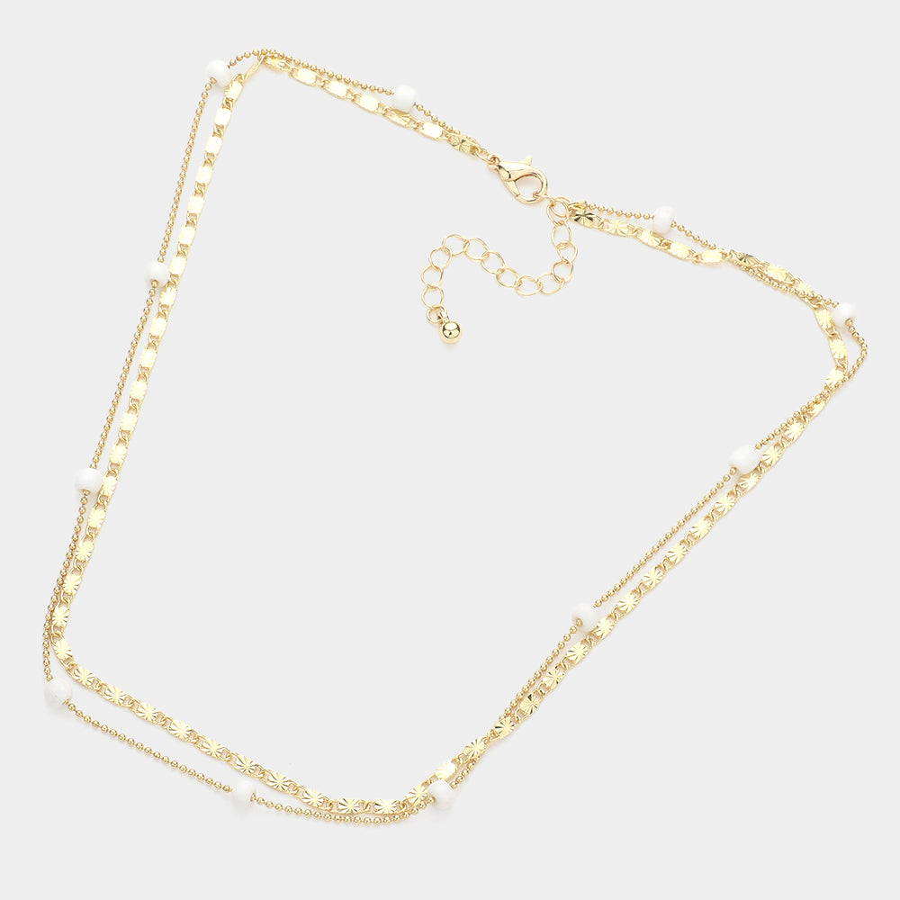 BEADED IN WHITE